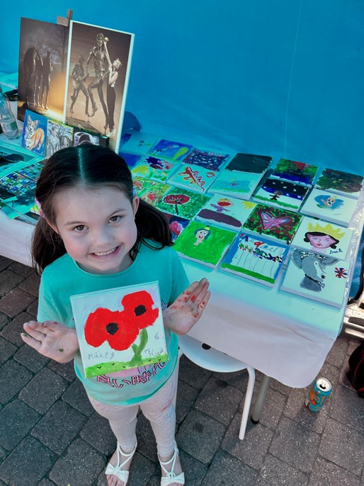 Little girl at Second Sundays event to help design robes