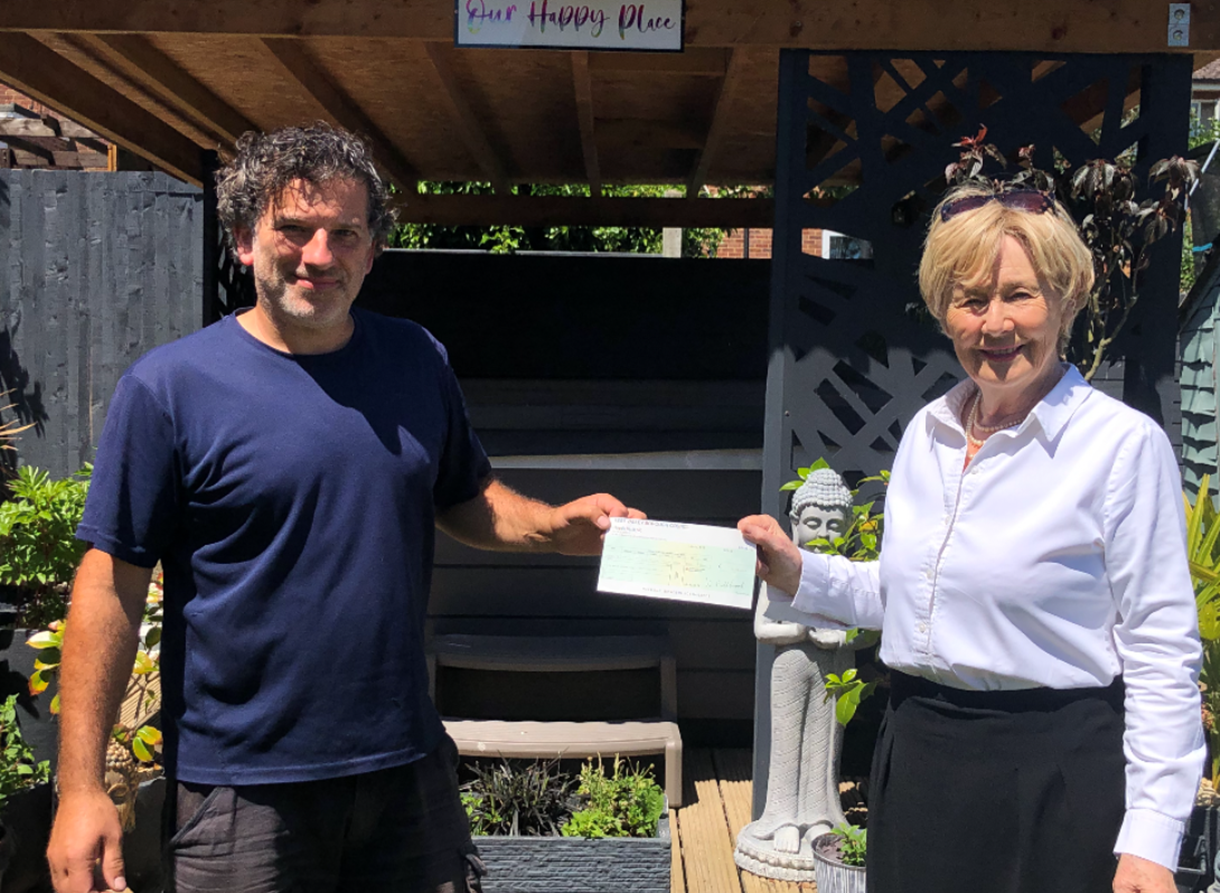 Lawn and Order Cllr Brooks presents cheque to Mark Gonsalves