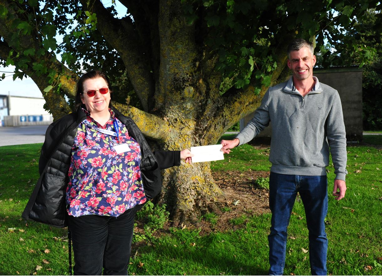 Councillor Lashbrook presenting a £750 Business Incentive Grant to Tony Macdonald.