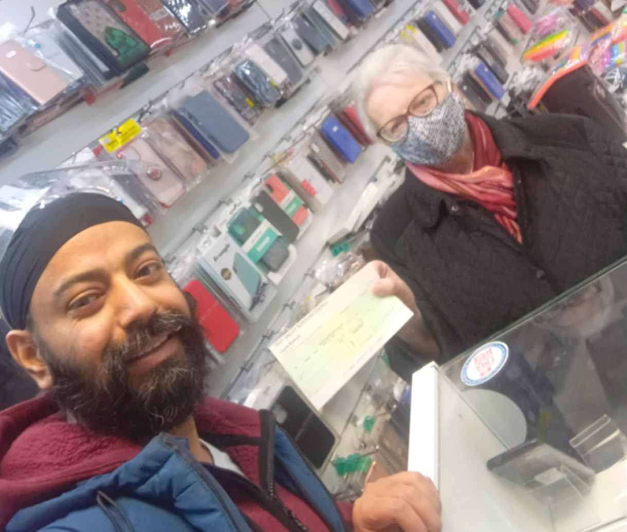 Cllr Iris Andersen presents the Independent Retailer Grant to business owner Mahinder Singh Poplee